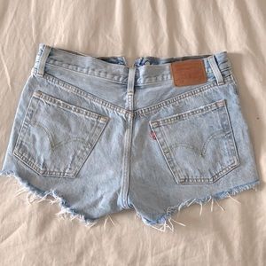 LEVIS SHORTS- they are light wash distressed shorts (size 26)
